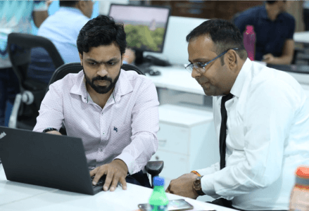 Two man discussing their wok