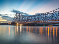 The iconic Howrah Bridge in Kolkata -, representing the city's infrastructure and connectivity.